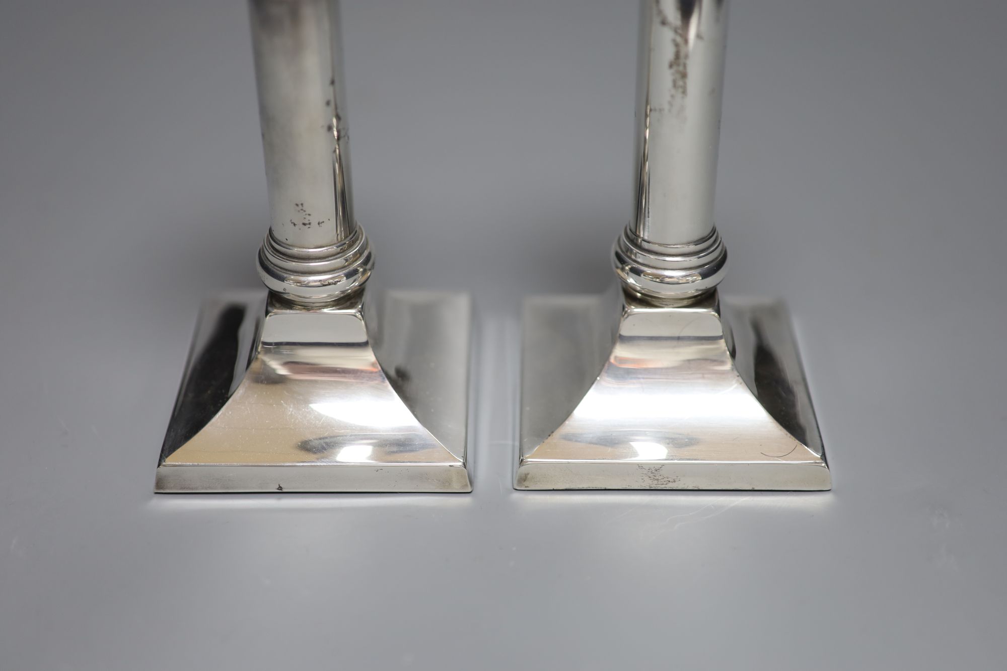 A pair of modern 925 sterling dwarf candlesticks, height 14.5cm, weighted.